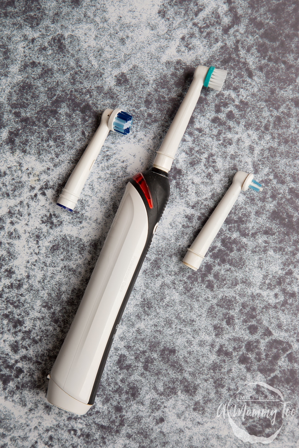 a electric toothbrush with two separate head attachments.