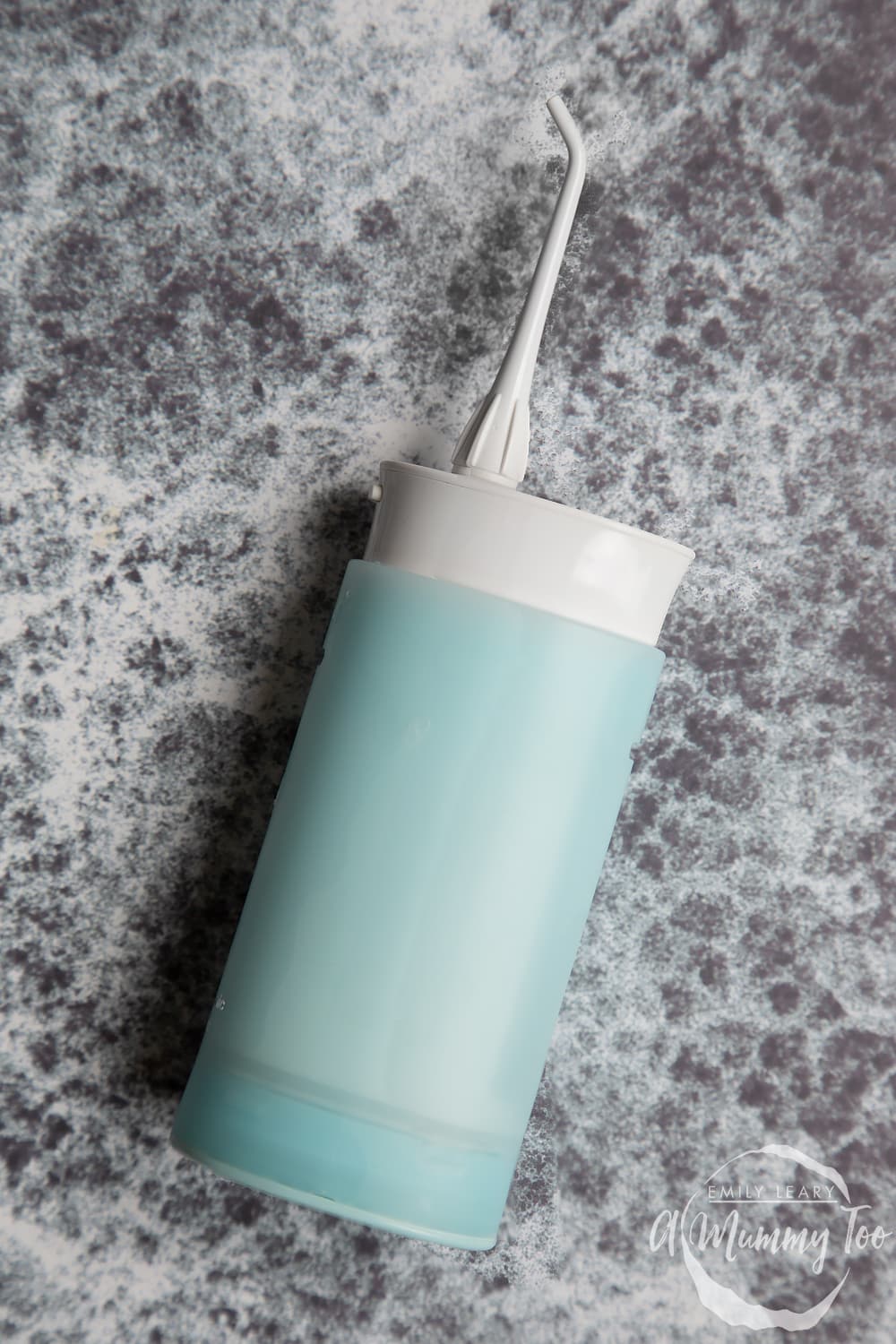 water flosser on a grey background