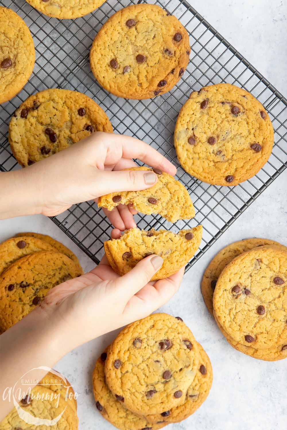 dairy free chocolate chip cookies torn apart on a cooling rack.