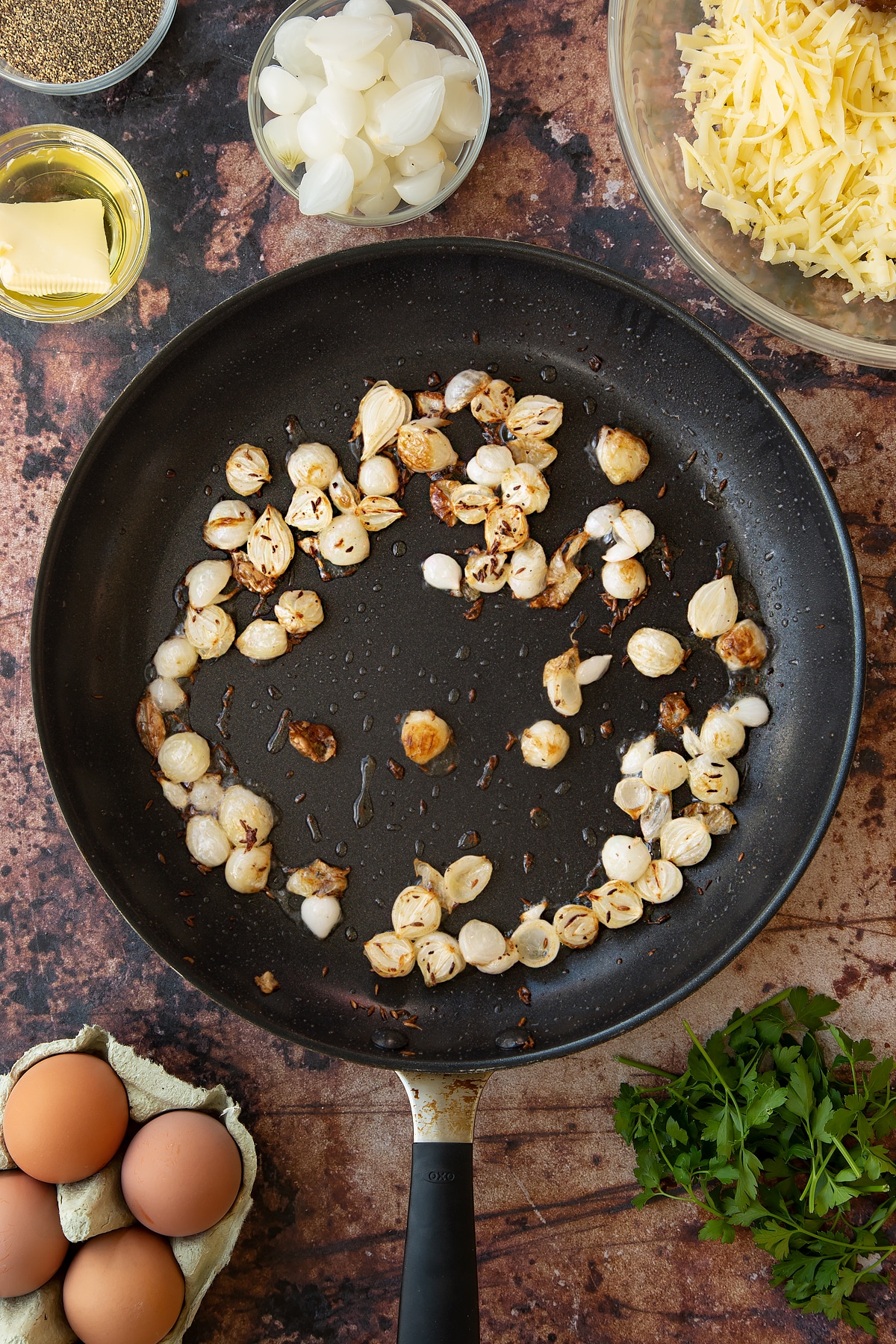 Overhead shot of some of the ingredients required for the mini cornish pasties in a pan.