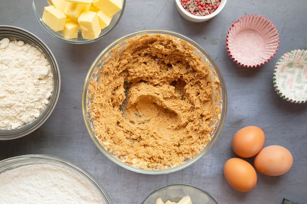 Mixing together the ingredients to make the sponges for the spiced Christmas cupcakes with marzipan frosting.