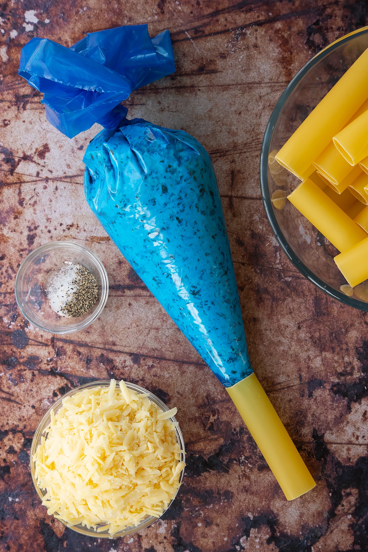 Overhead shot of a piping bag filled with the spinach and ricotta filling.
