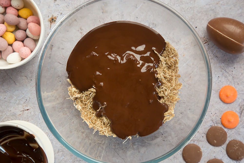Mix the melted chocolate with the shredded wheat to create the nest
