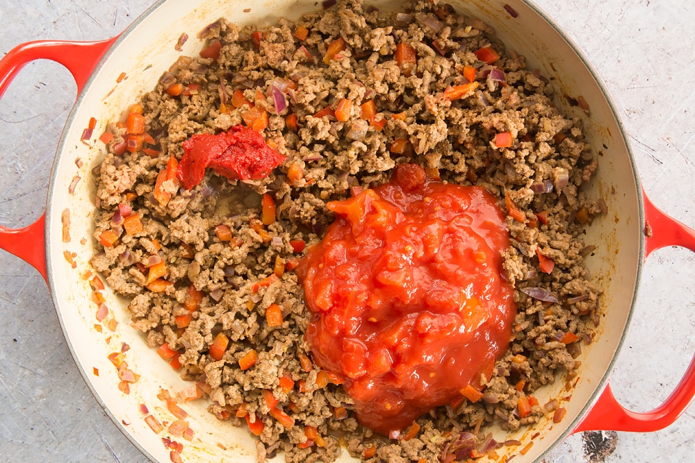 Cooked onion, red pepper, garlic, oregano and chilli powder, beef mince topped with chopped tomato sauce.