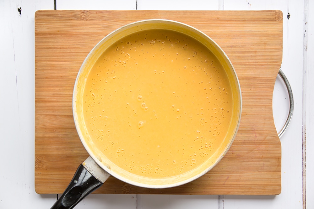 roasted butternut squash soup ingredients after being blitzed using a stick blender.