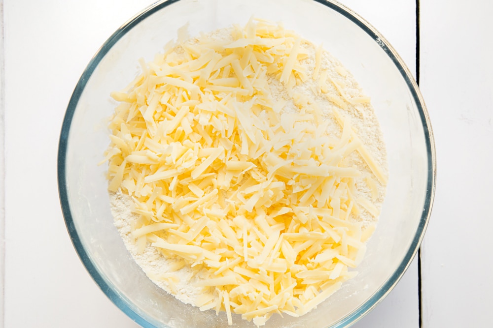 Add grated cheese to the scone mix