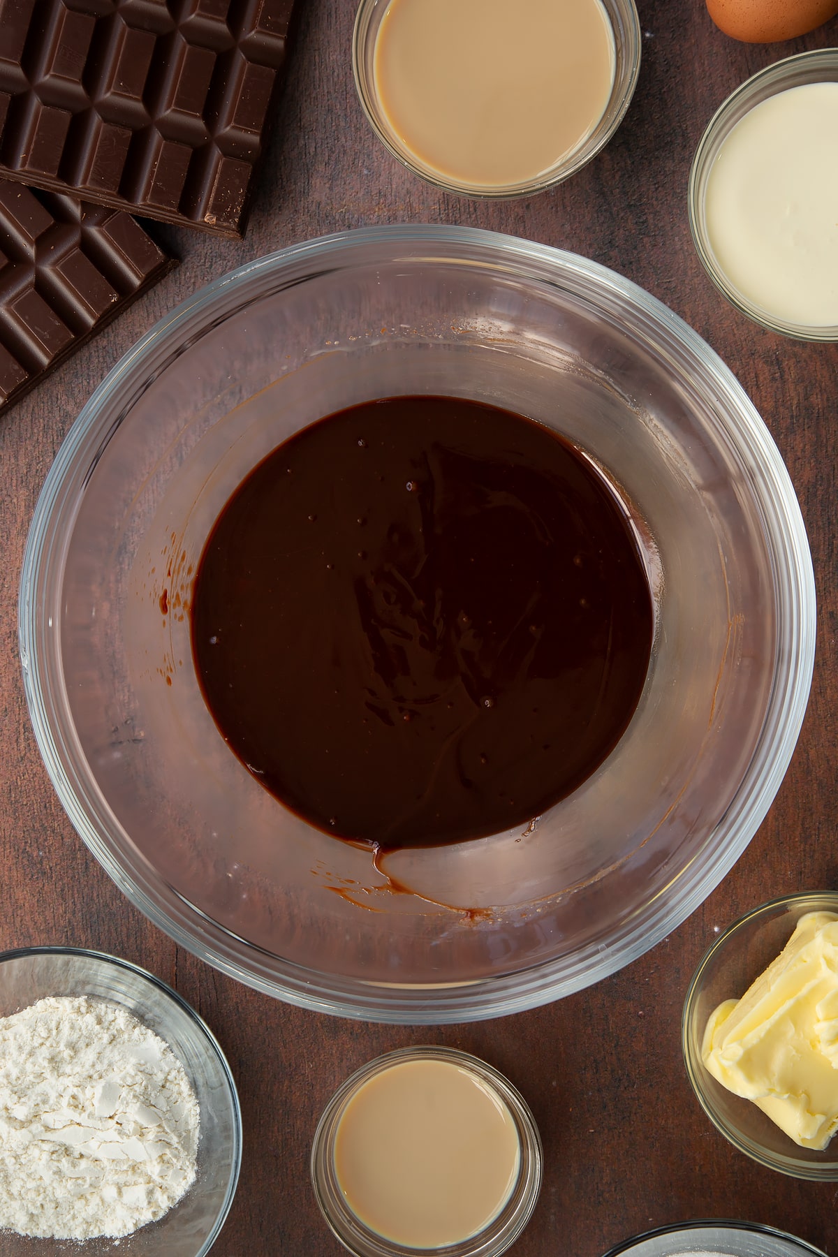 melted chocolate, cream and Baileys in a clear bowl.