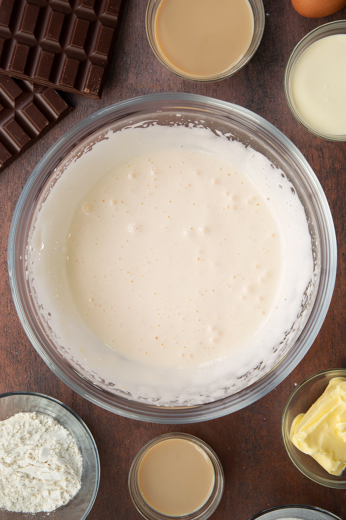a pale creamy mixture in a large clear bowl.