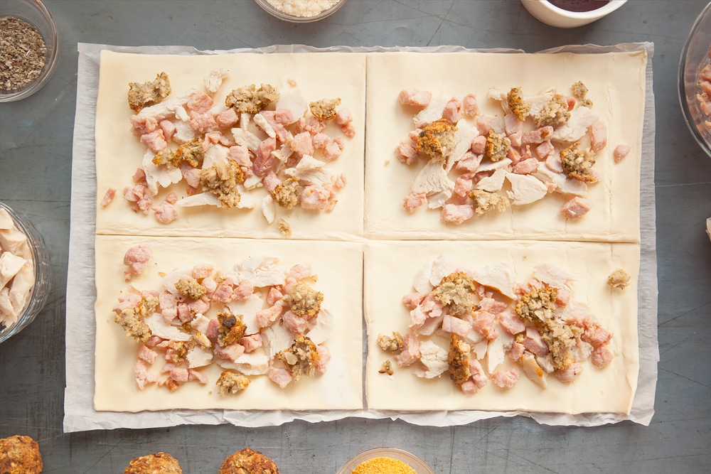 Adding bacon turkey and stuffing to the pastry rectangles.