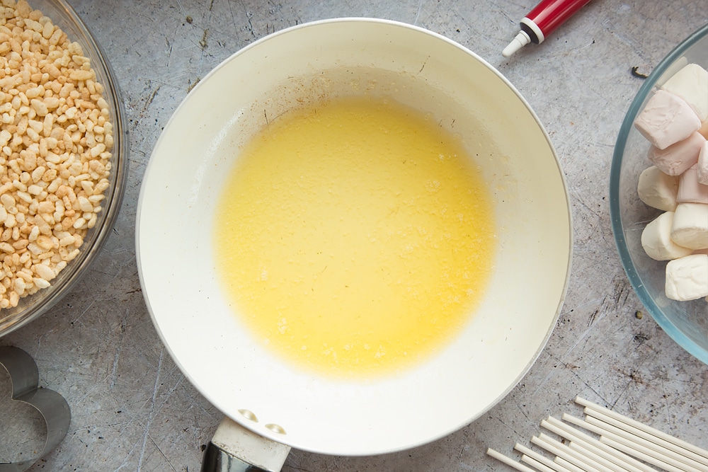Melting butter in a pan for the heart shaped crispy cake pops.