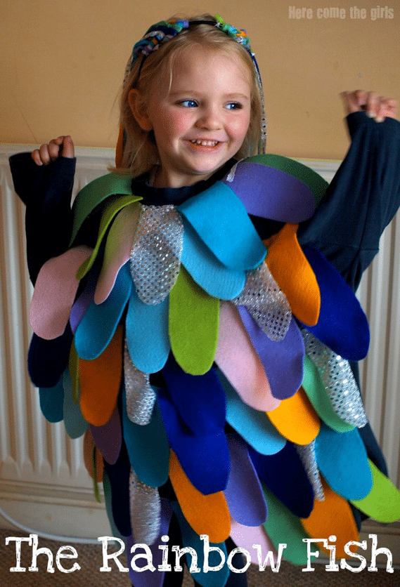 A little girl wearing a costume of a 'rainbow fish".
