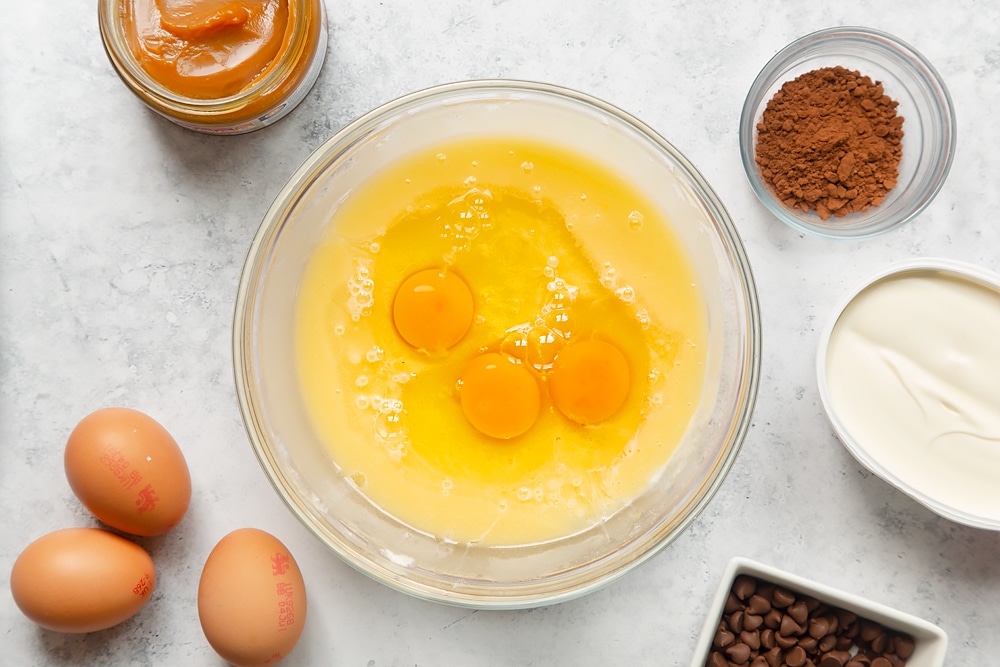 Add eggs to the cake mixture