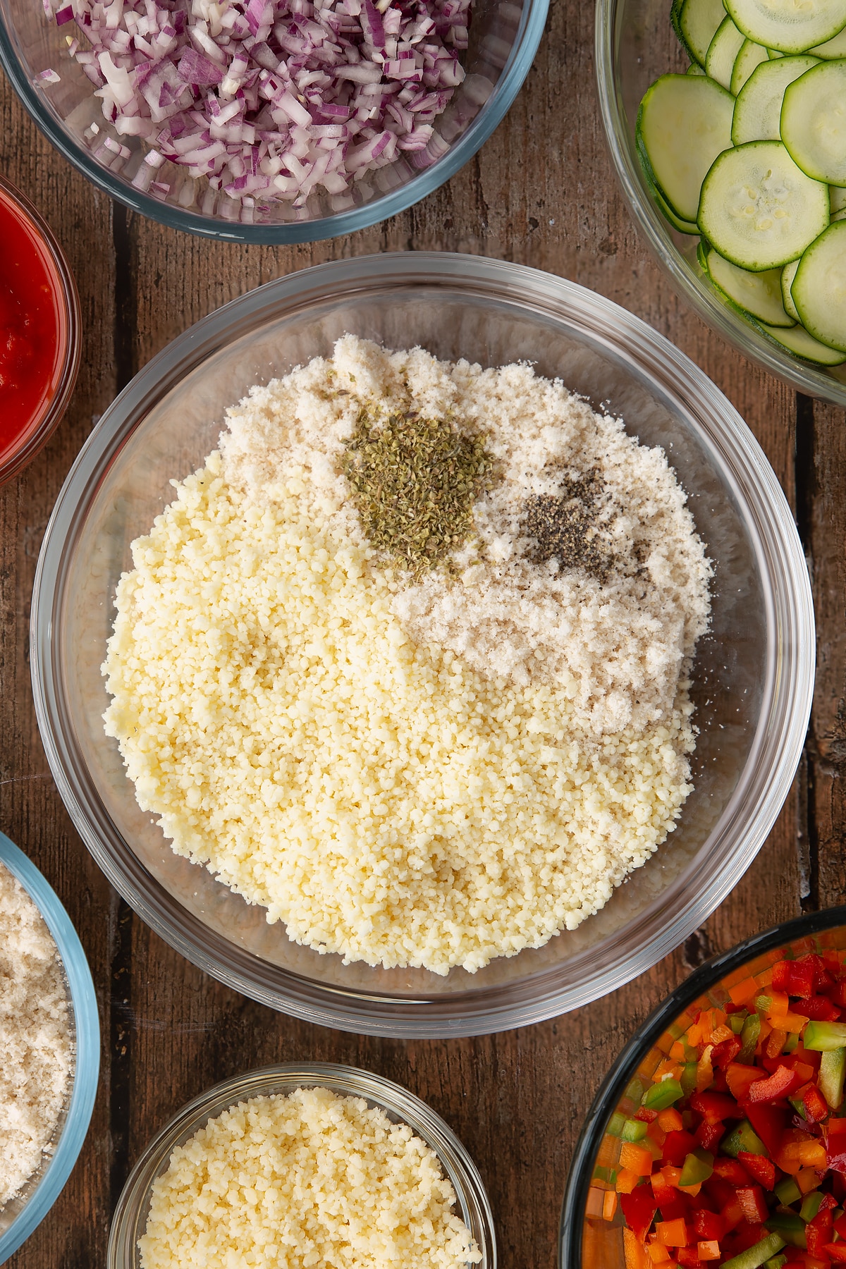 fresh breadcrumbs, dried oregano, and parmesan in a large clear bowl.