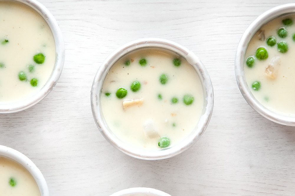 Add white sauce to your mini fish pies