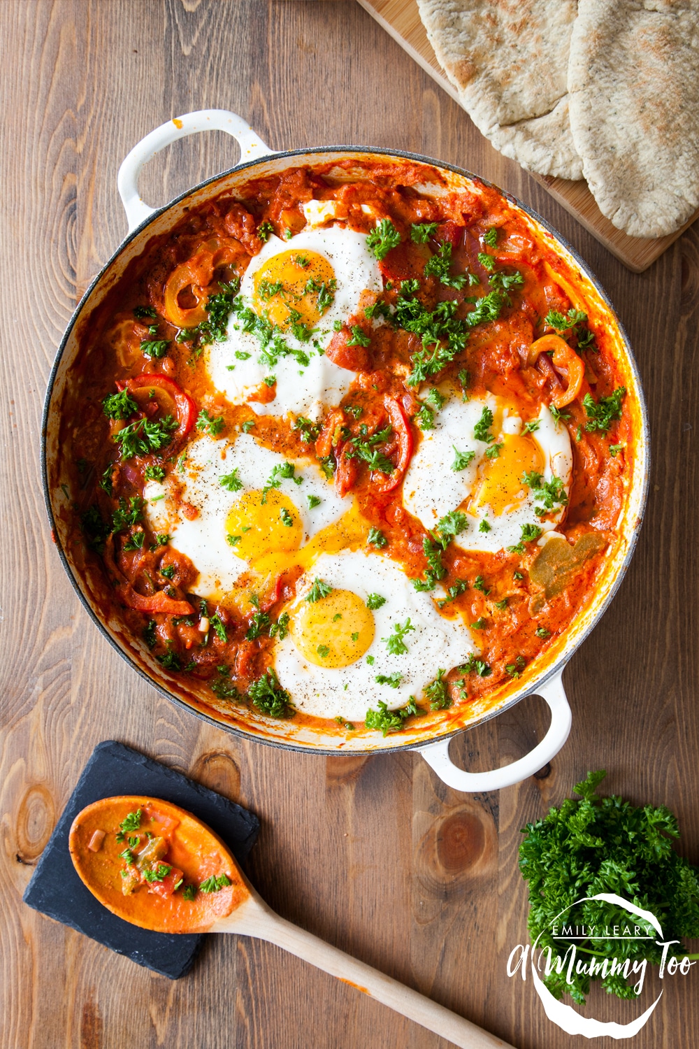 Baked eggs in a spicy tomato bake in a casserole dish