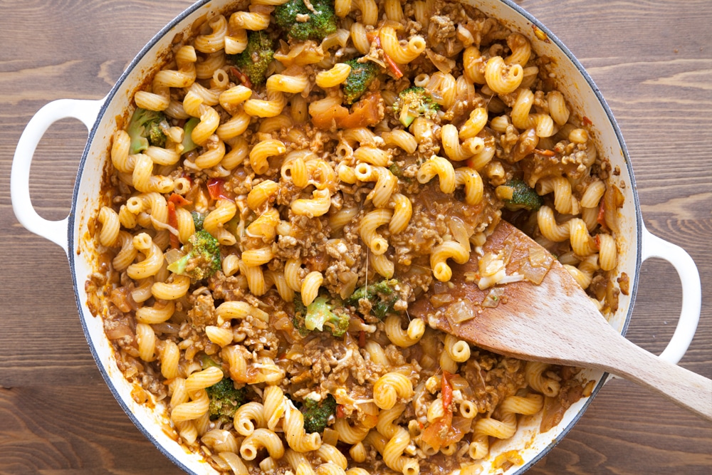 Preparing the chunky keema pasta bake for the oven