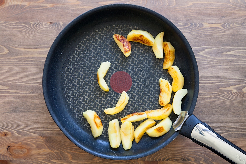 The sliced apple in coconut oil starting to caramelise