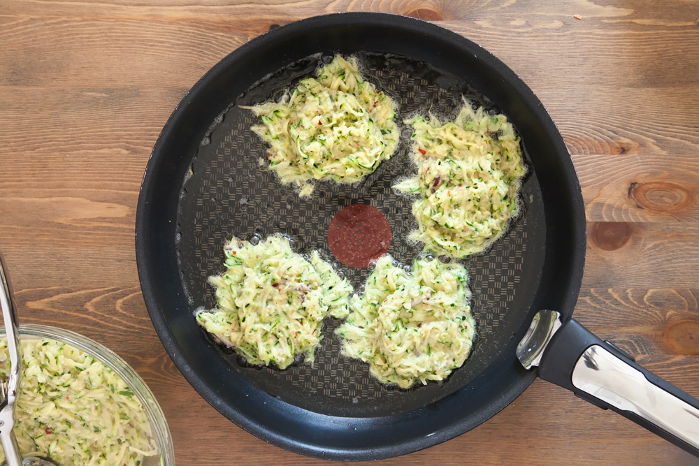 Spoon the courgette latke mix into a frying pan