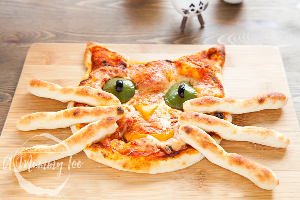 Freshly baked kitty pizza with breadstick whiskers - ready to be served!