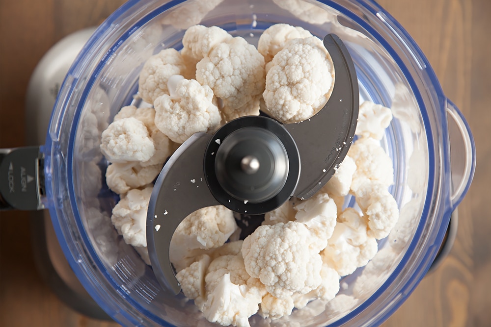 Preparing the cauliflower for the crust in a food processor