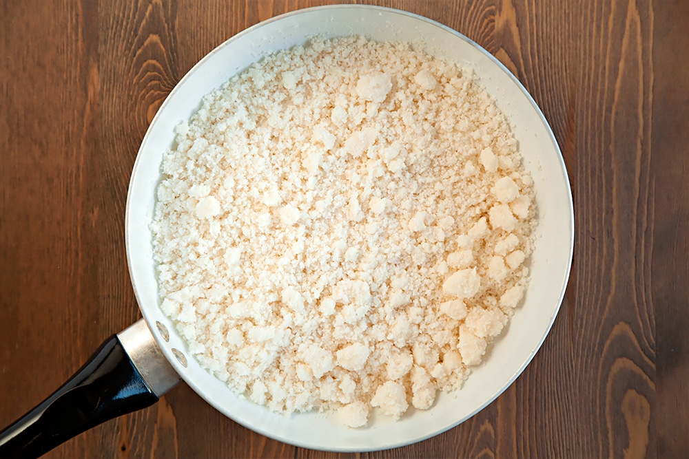 Preparing the cauliflower for the crust for this delicious Grana Padano and Prosciutto di San Daniele cauliflower crust pizza