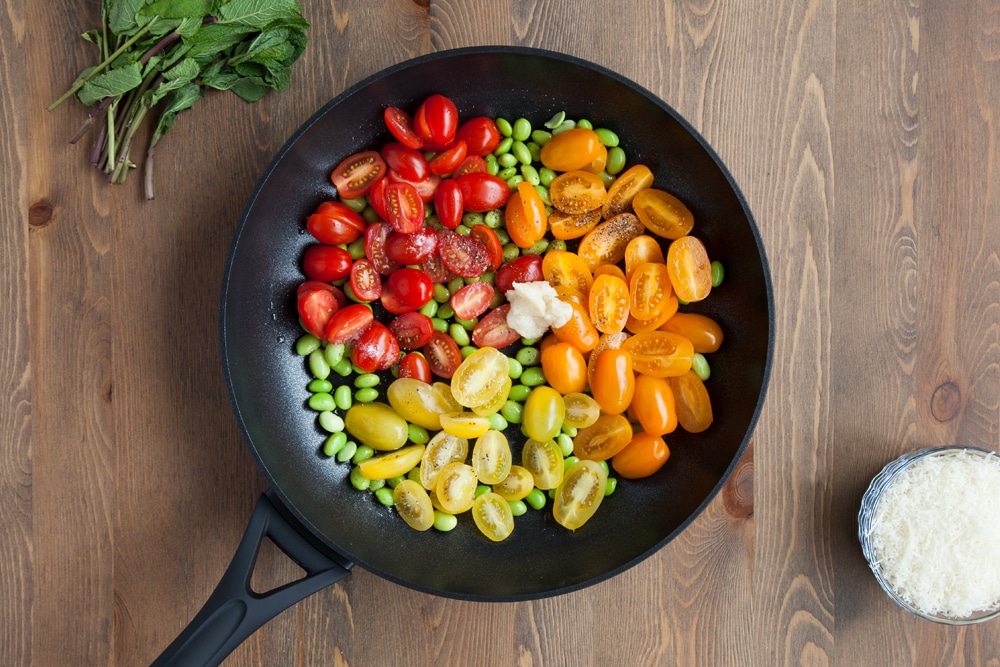 Adding tricolour tomatoes to the frying pan