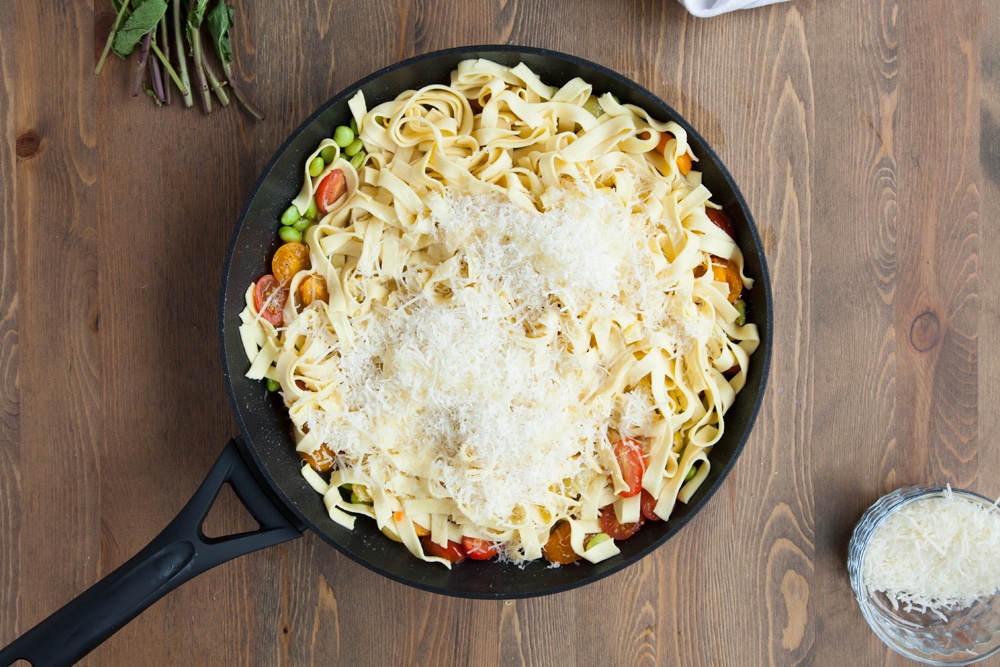 Olive oil and grated hard cheese are added to the dish
