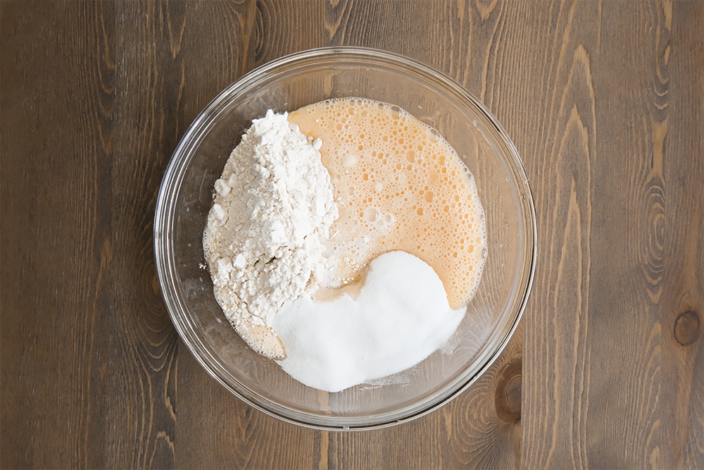 eggs, flour, sugar, vanilla essence and splash of the milk in a large clear bowl.