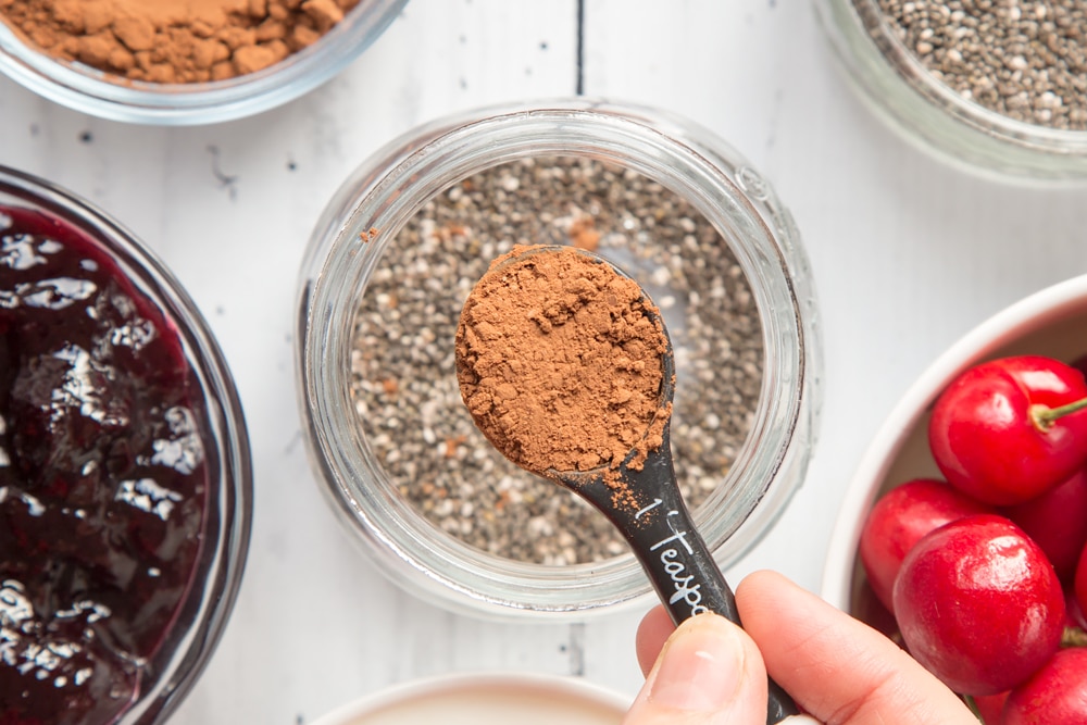 Cocoa powder, shown on a measuring spoon
