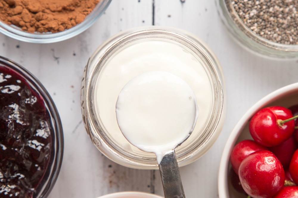 Once cooled in the fridge overnight, a layer of yogurt is added to the black forest breakfast jar