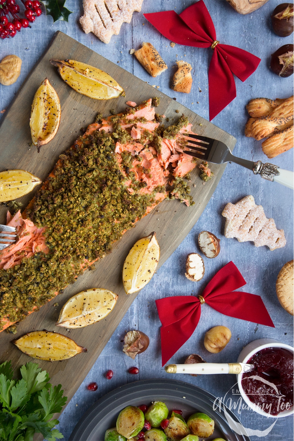 Freshly baked chestnut and pepper crusted wild Alaska salmon fillet, shown served at a seasonal family dinner