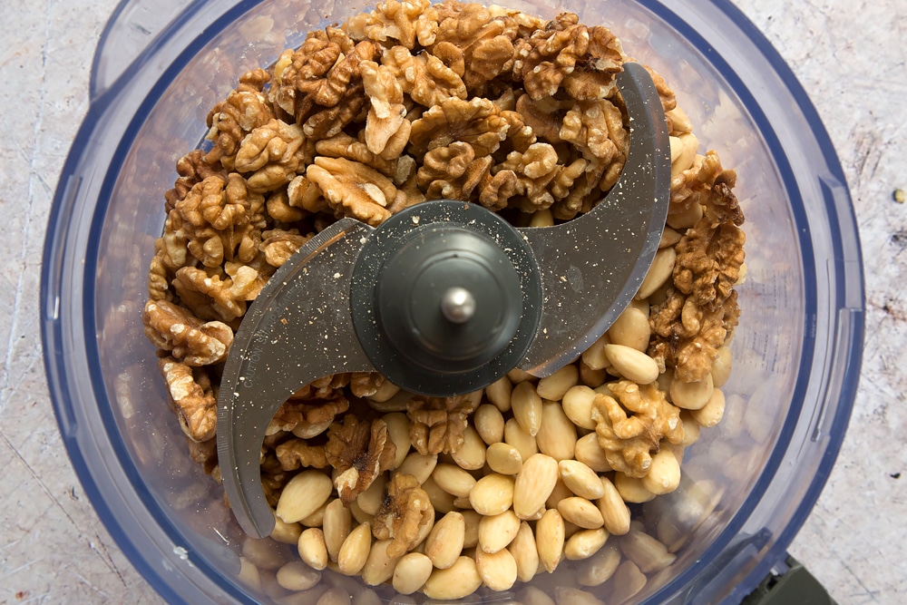 Mixed nuts, shown in a food processor