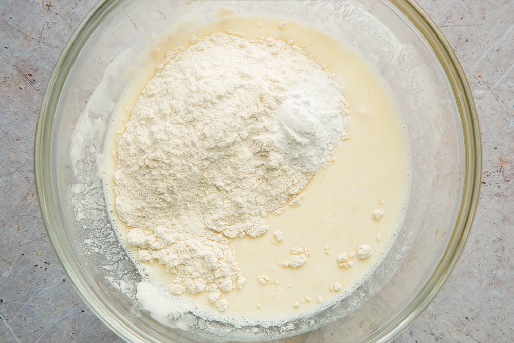 Flour and baking powder are added to the pancake mix