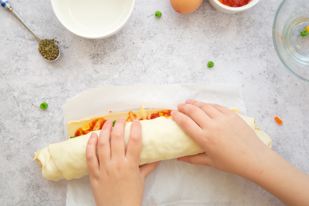 Assembling the veggie pizza roll-ups