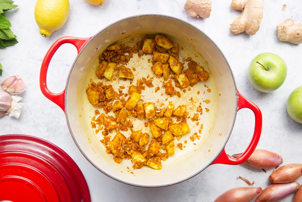 Making homemade curry sauce to accompany the cod and chips crusty rolls