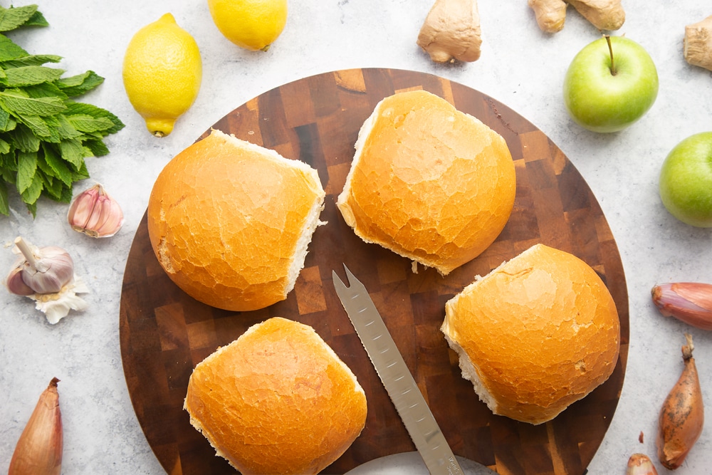 Crusty bread rolls on a wooden board