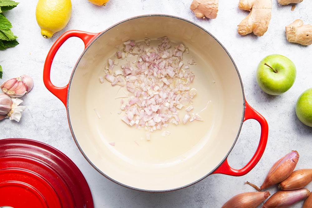 Heating onions over heat to make the curry sauce