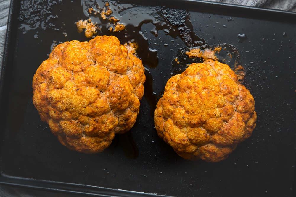 Harissa roasted cauliflower on a baking tray