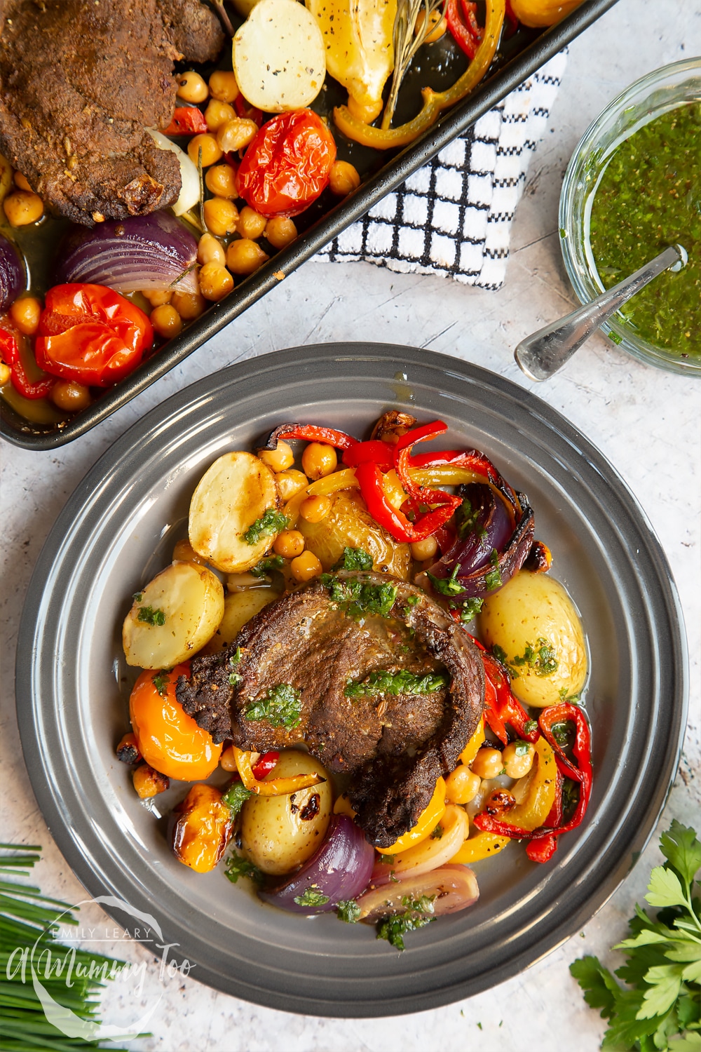 Close up of lamb steak and veg sheet pan meal served on a plate