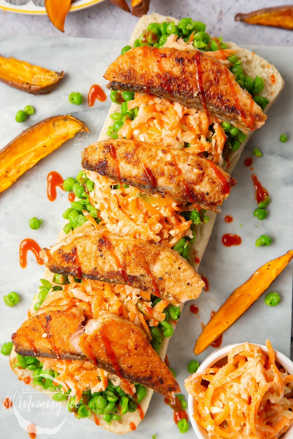 A healthier fish finger sarnie made with mushy peas, coleslaw and topped with seasoned salmon