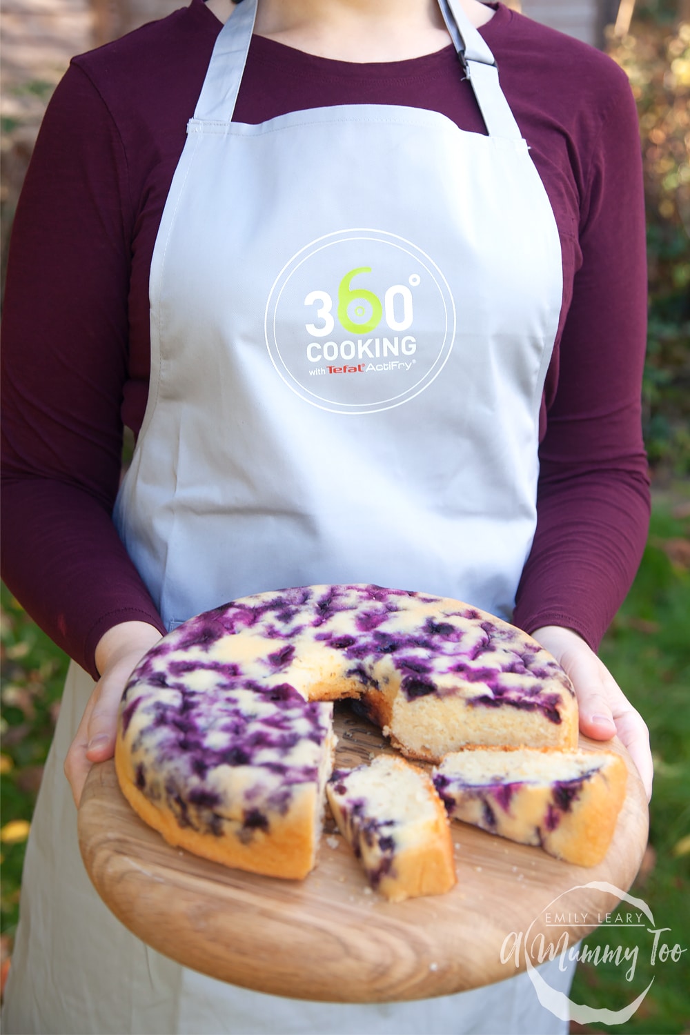 Emily Leary holding a blueberry cake