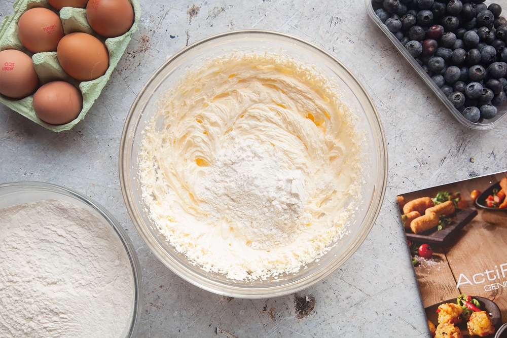 Adding flour to the cake mixture