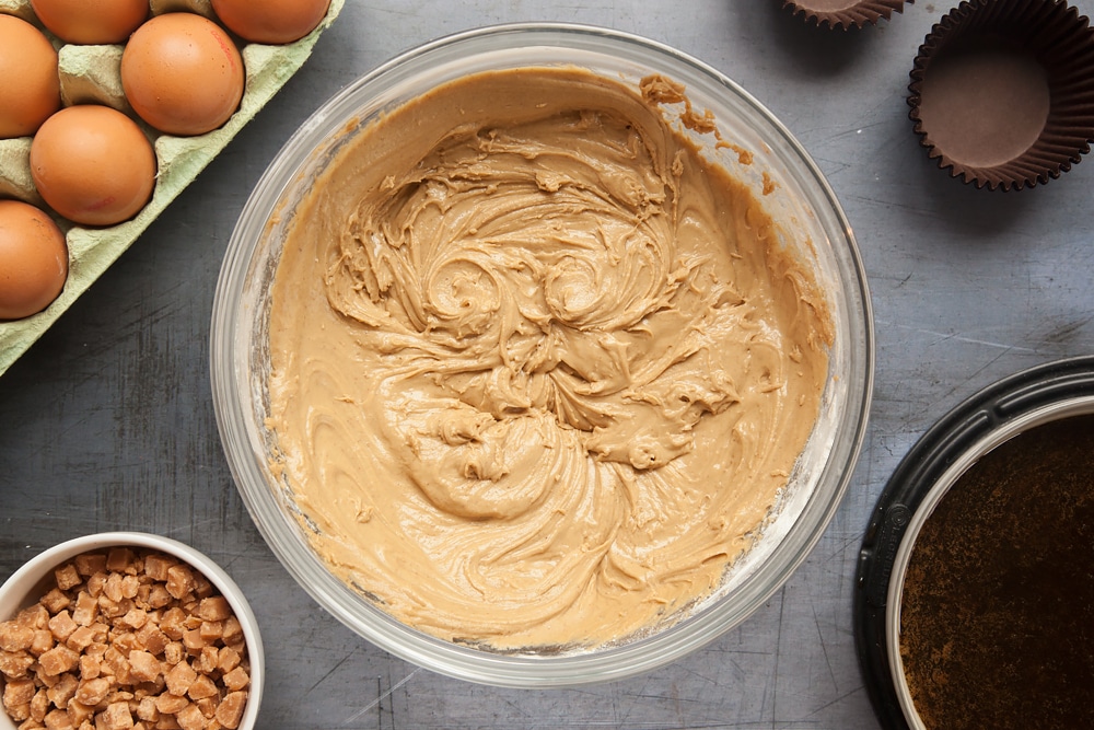 Overhead shot of frosting mix in a clear bowl