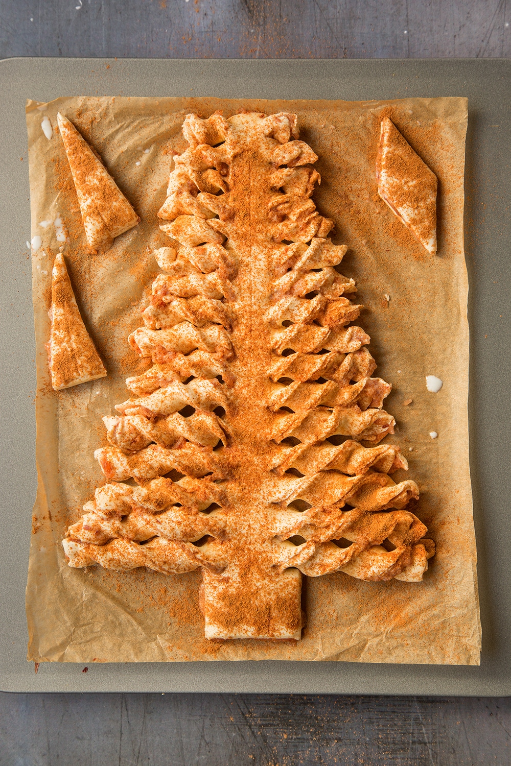 Transfer your puff pastry Christmas tree and offcuts to a baking tray