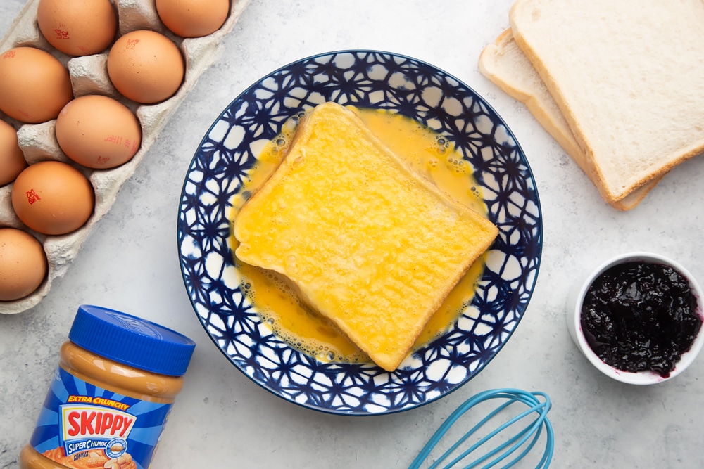 Dipping bread into the egg mixture