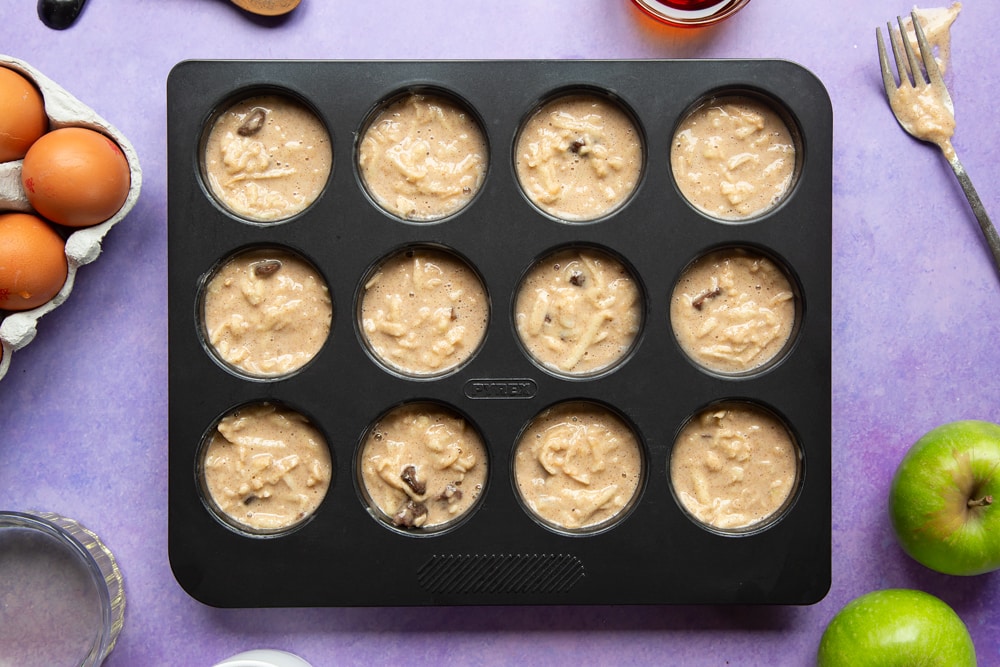 No junk apple and strawberry muffins - batter in a muffin tray.