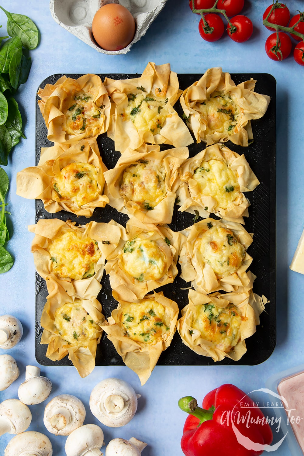 Filo pastry mini quiches - freshly baked and out of the oven still in their muffin tin.