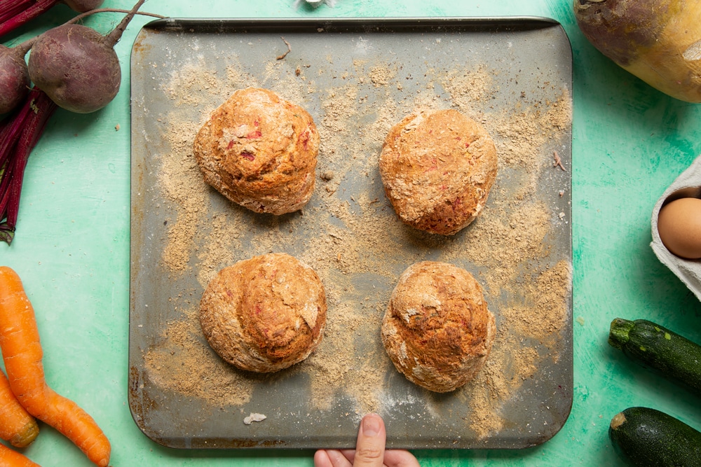 Vegetable soda bread rolls recipe - baked soda bread rolls on a floured baking tray.