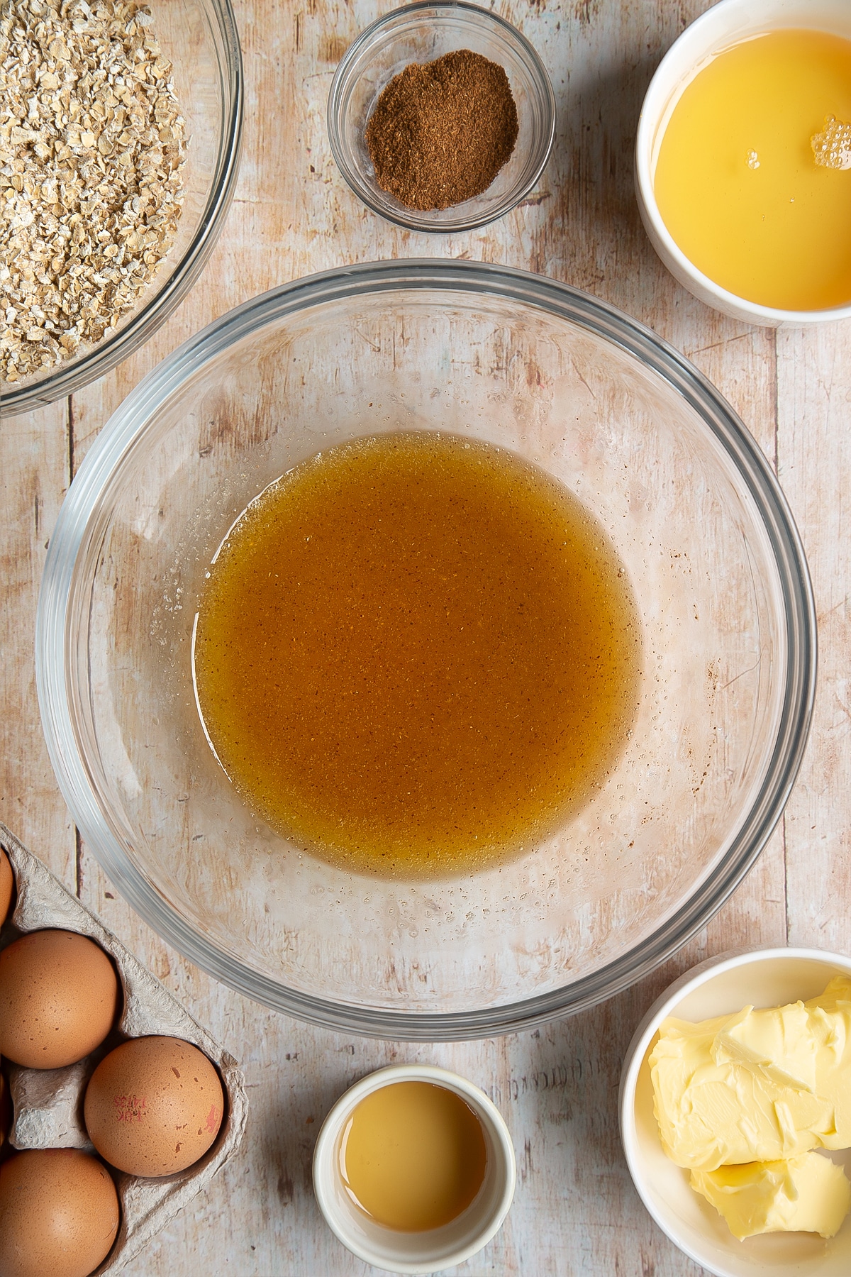 Overhead shot of liquid mix in a clear mixing bowl