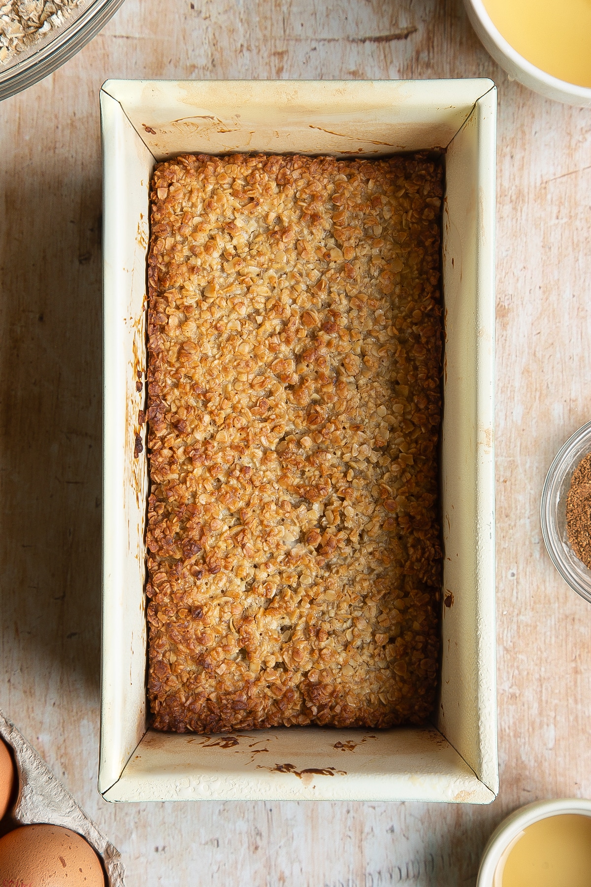 Overhead shot of fruity cakey oat bar in a loaf tin